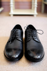 pair of black shoes on the floor