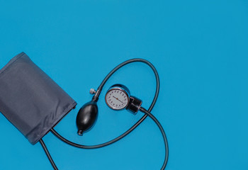 Aneroid blood pressure kit for pressure measurement on a blue background. medical concept, health...