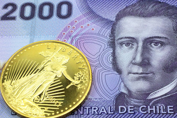 A macro image of a purple 2000 peso bank note from Chile with a gold coin.  Shot close up.