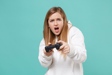 Irritated young woman girl in casual white hoodie posing isolated on blue turquoise background...
