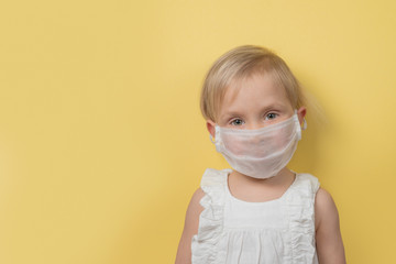 Coronavirus cocept - girl wearing face mask pastel background