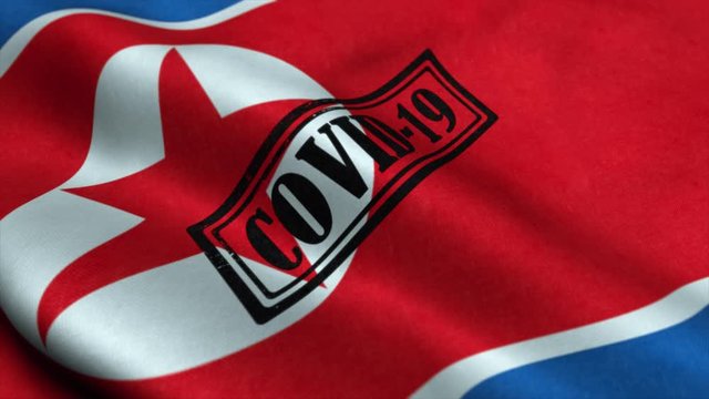 Covid-19 stamp on the flag of North Korea. Coronavirus concept