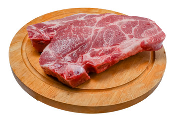 Raw steak from pork neck tender lies on a wooden Board on a white background. Isolated