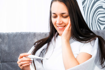 Pregnancy test. Happy young woman is pregnant.