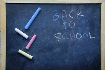 back to school concept with chalk and black board 