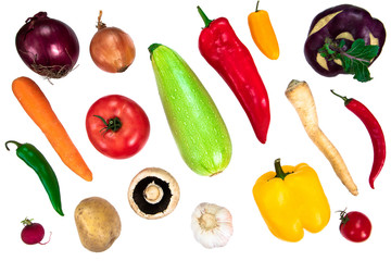 Composition with raw vegetables isolated on white. Different varieties of peppers, tomatoes, mushrooms and other produce
