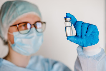 Doctor, nurse, scientist hold COVID-19 vaccine for the disease Coronavirus. Use for prevention,...
