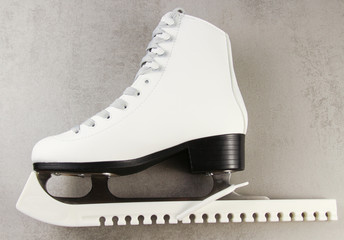 White female figure skate on a light background.