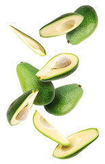 ripe avocados flying isolated on white background with clipping path