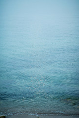 Transparent sea water and a beautiful blue sky. The sea scenery.