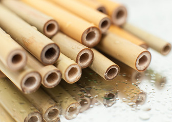 a set of reusable bamboo tubules for drinks, eco drinking straws, without plastic in the style of zero waste. Macro