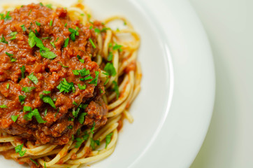 Minced beef bolognese with onions and carrots served with spaghetti