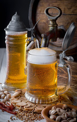Light beer in a glass, on an old background.
