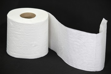 Toilet paper roll on black background