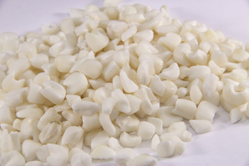 Canjica - Gr&atilde;o cru para canjica doce. Sobremesa brasileira faz parte da cultura brasileira na Festa Junina. Fundo branco.