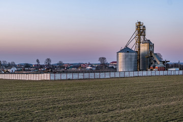 Obraz premium agro-processing and manufacturing plant for processing and silver silos for drying cleaning and storage of agricultural products, flour, cereals and grain. Granary elevator.