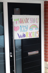 Child's thank you and rainbow painting on door for Coronavirus