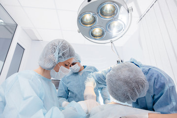 Operation in a modern operating room close-up, emergency rescue and resuscitation of the patient....