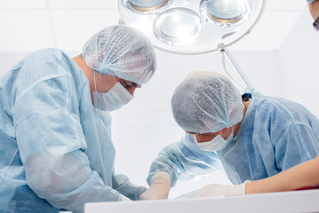 Operation in a modern operating room close-up, emergency rescue and resuscitation of the patient....