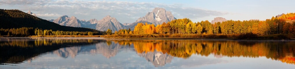 Panorama of Fall Color in front of the Grand Teton Range and Mt. Moran at the Oxbow Bend of the Snake River