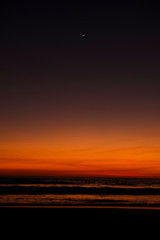 moon at sunset at the beach