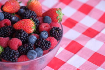 fresh berry fruits in a bowl on table