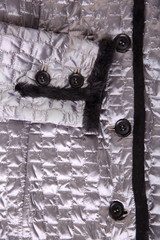 Fragment of a silver quilted jacket - ready winter clothing