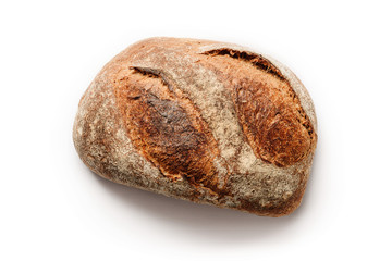 Loaf of homemade rustic bread isolated on a white background.
