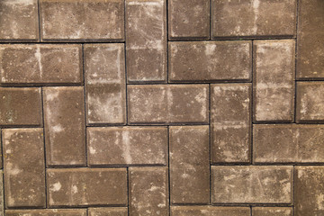 Paving slabs are brown in shape, paving Stones or Bricks. Construction, backgrounds, interior.