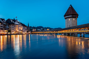 Fototapeta na wymiar Famous Chapel Bridge, the city's symbol and one of the Switzerland's main tourist attractions, Switzerland. Historic city center of Lucerne