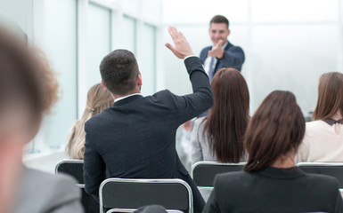 seminar participants ask questions at a business meeting