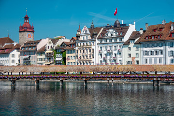 Famous Chapel Bridge, the city's symbol and one of the Switzerland's main tourist attractions on...
