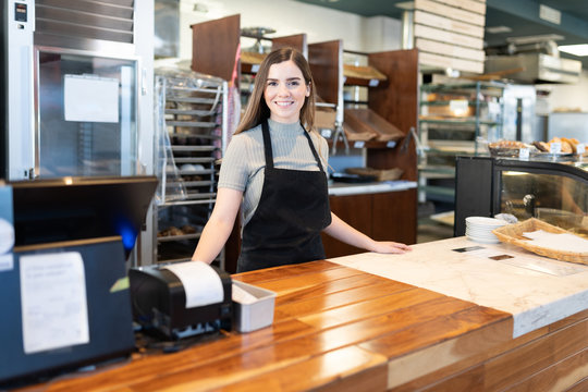 Entrepreneur Standing In Bakery Shop Counter