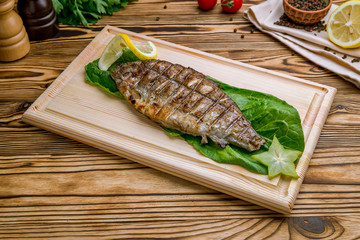 Dorado on grill on the board