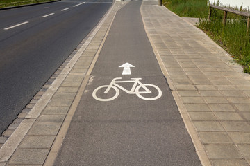 Sign of bicycle lane on asphalt road