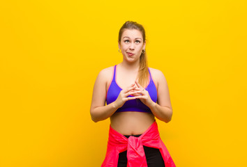 young blonde woman scheming and conspiring, thinking devious tricks and cheats, cunning and...