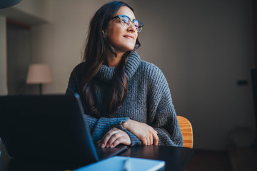 Happy attractive young woman working in modern office using laptop, businesswoman in casual wear working from home office on new product development strategy - Powered by Adobe