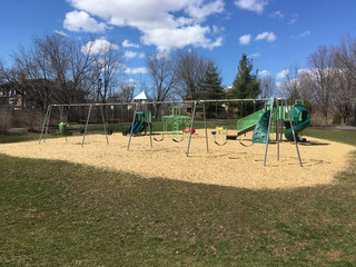 Fototapeta na wymiar Empty Playground on a Sunny Spring Day During COVID-19 Lockdown