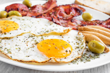 Breakfast with roasted bacon and roasted eggs