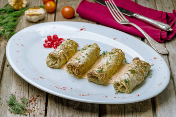 Stuffed cabbage on wooden table