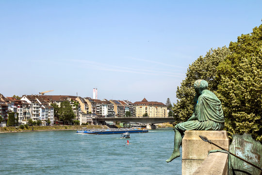 Basel, SWITZERLAND: Sitting Helvetia statue on the river Rhine in Basel, Switzerland