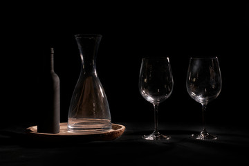 Obraz na płótnie Canvas Wine glasses with bottle and pourer.