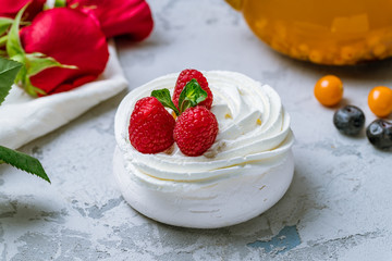 dessert Anna Pavlova with raspberries