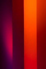 Gradient lines on the wall in blue, red, purple, orange colors