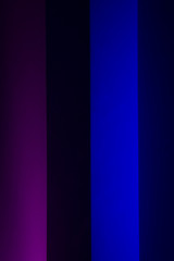 Gradient lines on the wall in blue, red, purple, orange colors