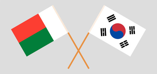 Crossed flags of Madagascar and South Korea