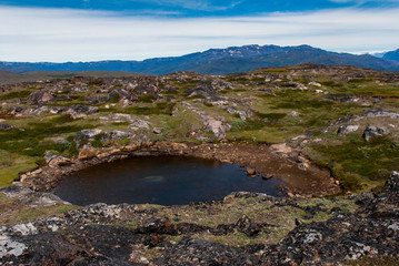Glacial lake in the mountains of Greenland.