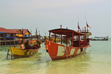 Fototapeta na wymiar Traditional boats from Cambodia at the coasts of Koh Rong