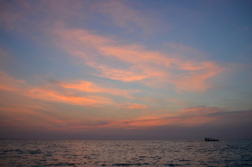 Sunset moment with pink clouds at the sky