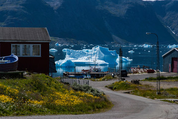 The view of town in Greenland and the bay with icebergs.